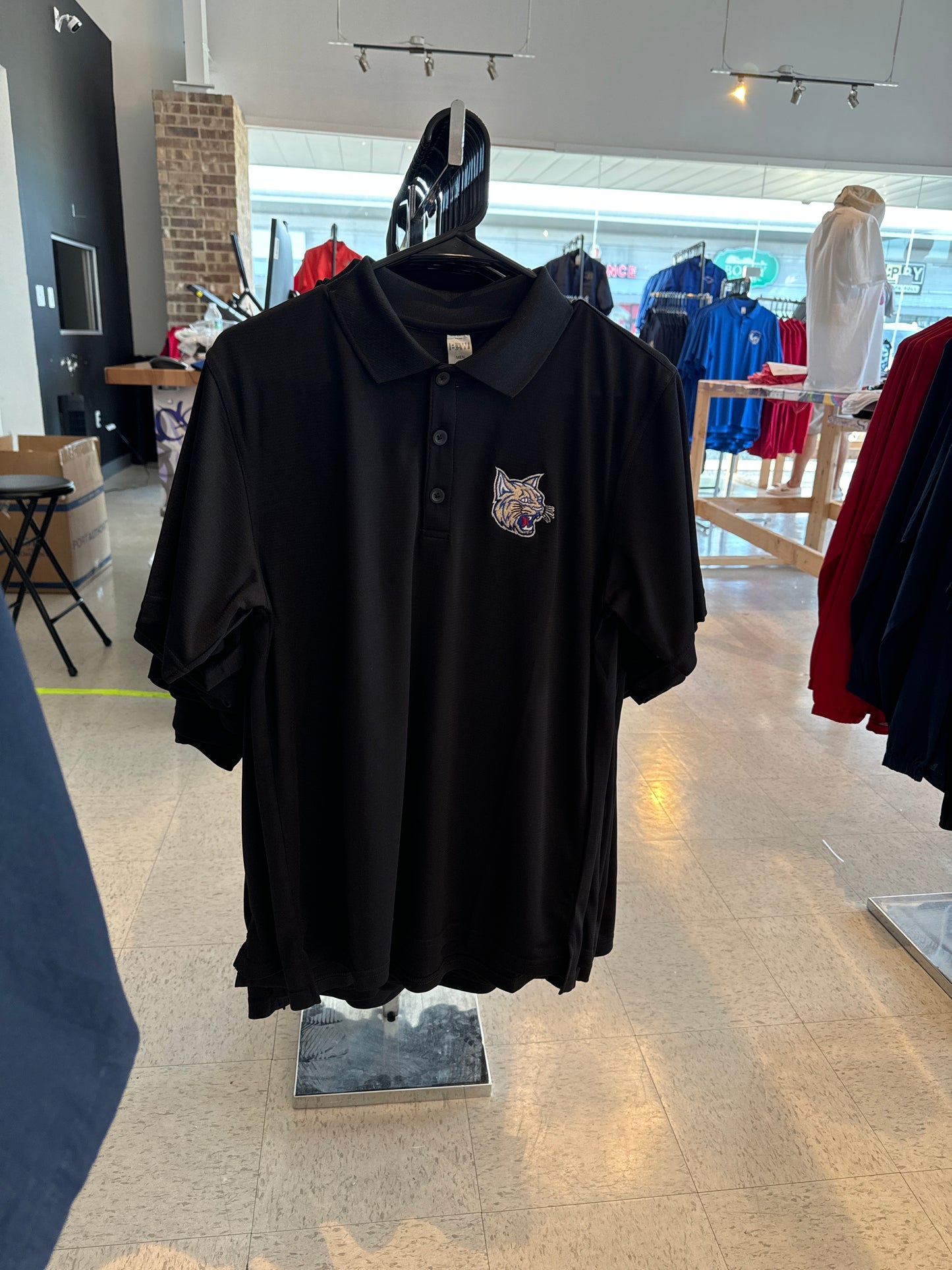 Black polo cat logo (bobcat)